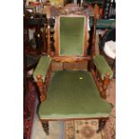 A Victorian mahogany green velvet armchair / smokers chair, with upholstered seat and back,