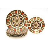 Seven Royal Crown Derby 10 inch diameter 1128 Imari pattern dinner plates,