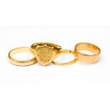 An 18ct gold signet ring, engraved monogram and two 18ct rings,