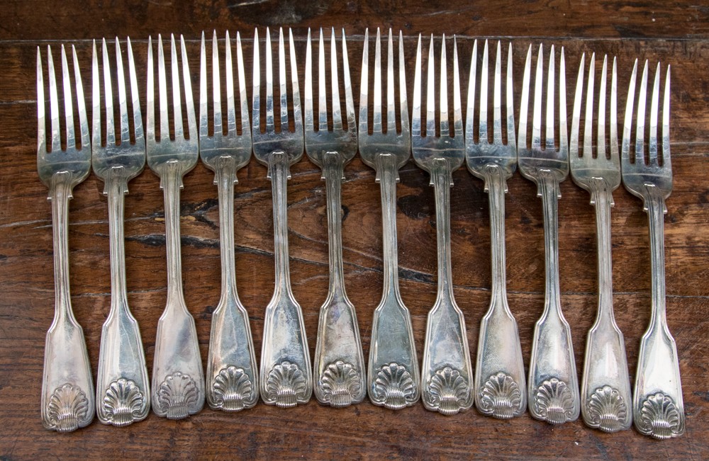 A set of twelve Victorian silver fiddle and shell pattern dinner forks, London 1868,