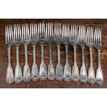 A set of twelve Victorian silver fiddle and shell pattern dinner forks, London 1868,