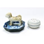 Chinese powder bowl and cover with blue and white trinket dish having dog decoration.