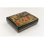 A Russian lacquer box, the black ground,