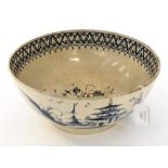 An 18th Century English creamware blue and white bowl with Chinoiserie decoration,
