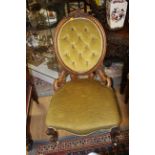 A Victorian walnut deep button backed upholstered ladies chair