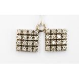 A pair of square diamond set pendants,