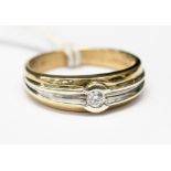 A diamond two-colour 9ct gold ring, the centre diamond weighting approximately 0.