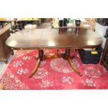 A Victorian style pull out mahogany double pedestal dining table