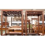 A pair of Chinese hardwood side tables,