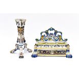 A Faience desk tidy/inkwell, two ink wells, two draws and stamp holder, with a Faience candlestick,