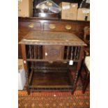 A Victorian carved oak occasional table,