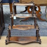 A Victorian Rosewood four tier whatnot, of graduated form, serpentine form,