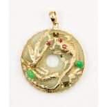 A jade 14ct gold circular pendant with applied gold phoenix and jade gem set decoration,