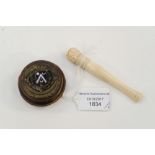 An Ivory cigarette holder with foliate design;