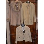 A ladies Burberry cream suede jacket with a Massimo Dutti cream jacket,