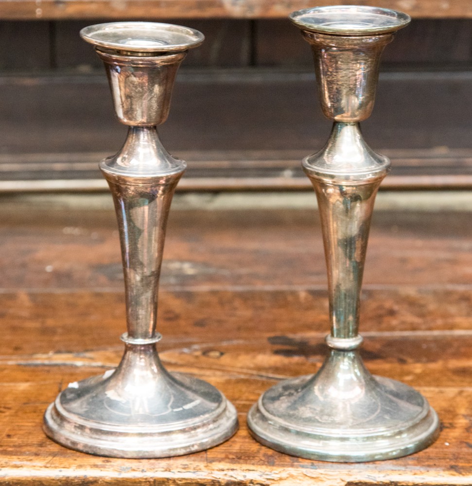 A pair of classical style silver candlesticks,