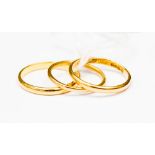 Three 22ct gold plain wedding bands, approx 7.