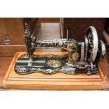 An 1870s Singer 12 Fiddleback 'Ottoman' or 'Peacock Tail' design case sewing machine