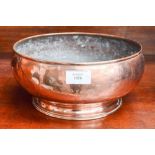 A hammered copper bowl,