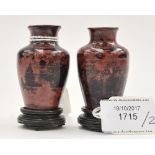 A pair of Chinese miniature composite marble effect vases on hardwood stands (2)