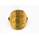 A half sovereign moulded ring, gross weight approx 4.