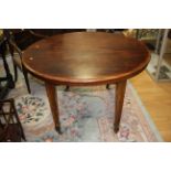 An Edwardian mahogany dining table,