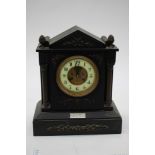 A 19th Century black slate mantle clock, classical form with Corinthian columns,