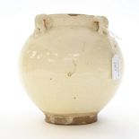 A glazed white terracotta bulbous vase,