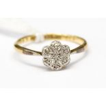 A diamond ring set as a flower, 18ct yellow gold and platinum set,