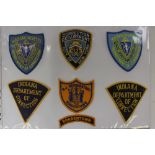 A large collection of over seventy US Department of Correction Prison Officers Shoulder Sleeve