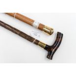 A Malacca walking cane with 18ct gold knop handle; together with a walking cane with gold collar,