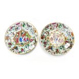 A pair of Chinese Famille rose plaques, enamelled over an inscribed celladon base,