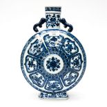 A Chinese blue and white moonflask, wheel lappet design with floral banding and twin handles,