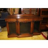 Early Victorian rosewood break front credenza, three glass doors,