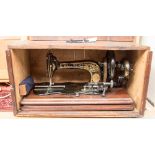 An 1890s William Sellers Fiddleback British case sewing machine