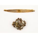 A Pinchbeck momento mori brooch 19th century, feather designed hair with pearls,