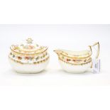 A Wedgwood sugar bowl with lid and a cream jug, hand enamelled and gilded decorations with Reg. No.