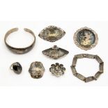 A quantity of Siamese Niello jewellery to include, five brooches, a bangle,