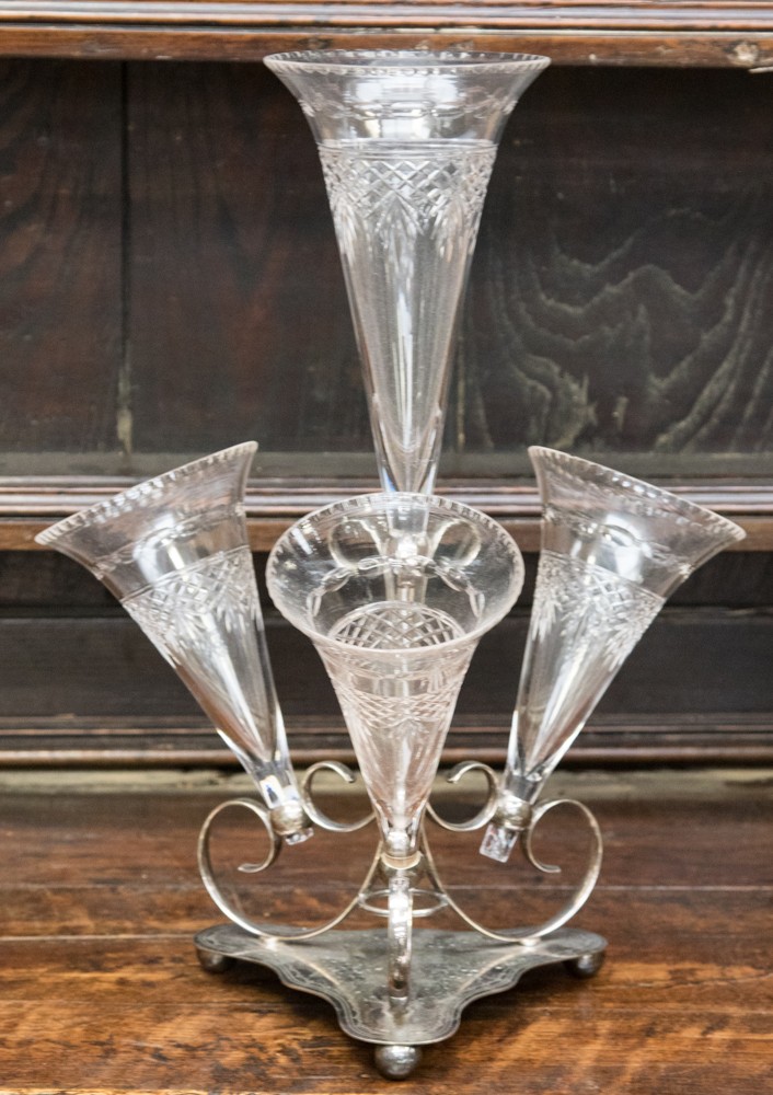 An Edwardian silver plate epergne, with four detachable cut-glass trumpet shaped vases,