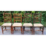 A matched set of eight early 19th Century and later ash spindle back chairs,