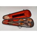 A 19th Century or earlier violin, in wooden case. Length of back: 14 1/4".