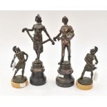 Two pairs of bronze figures (4)