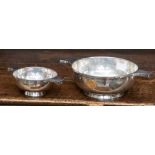 A George V silver two handled footed bowl, Birmingham 1931, in the Arts and Crafts quaich style,
