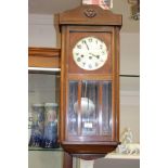 A 1920s oak wall clock, Westminster chime,