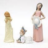 A Lladro figure of a girl holding a hat, number 5008,