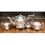 A three piece silver tea set comprising teapot with ebony handle and finial,