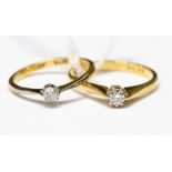 Two diamond and solitaire 18ct gold rings