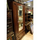 An Edwardian mahogany single door wardrobe