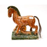 A Chinese teracotta glazed horse ridge roof tile,