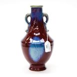 A Chinese sang de boef and blue glazed, twin handled vase, Daoquang mark incised,